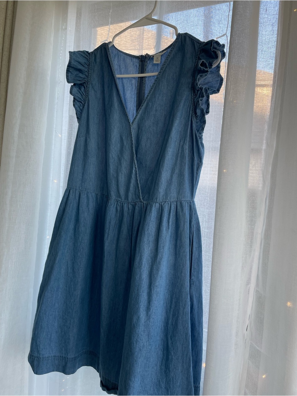 Womanโs Blue Denim Ruffle Sleeve Dress